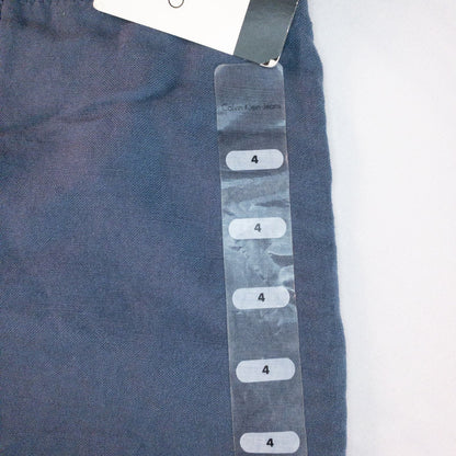 Calvin Klein blue linen shorts for women, size 4, with button closure and belt loops, front and back pockets, shown laid flat. image 13