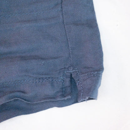 Calvin Klein blue linen shorts for women, size 4, with button closure and belt loops, front and back pockets, shown laid flat. image 5