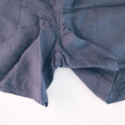 Calvin Klein blue linen shorts for women, size 4, with button closure and belt loops, front and back pockets, shown laid flat. image 4
