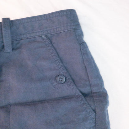 Calvin Klein blue linen shorts for women, size 4, with button closure and belt loops, front and back pockets, shown laid flat. image 3