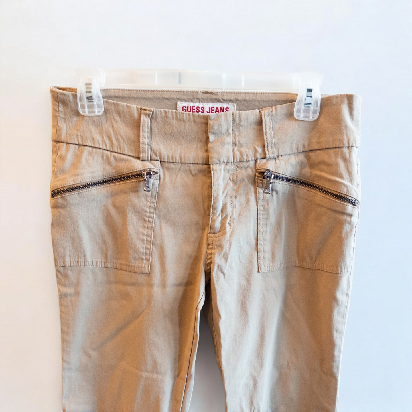 Guess vintage Y2K khaki flare pants with zippered pockets and relaxed fit hanging on a hanger image 2