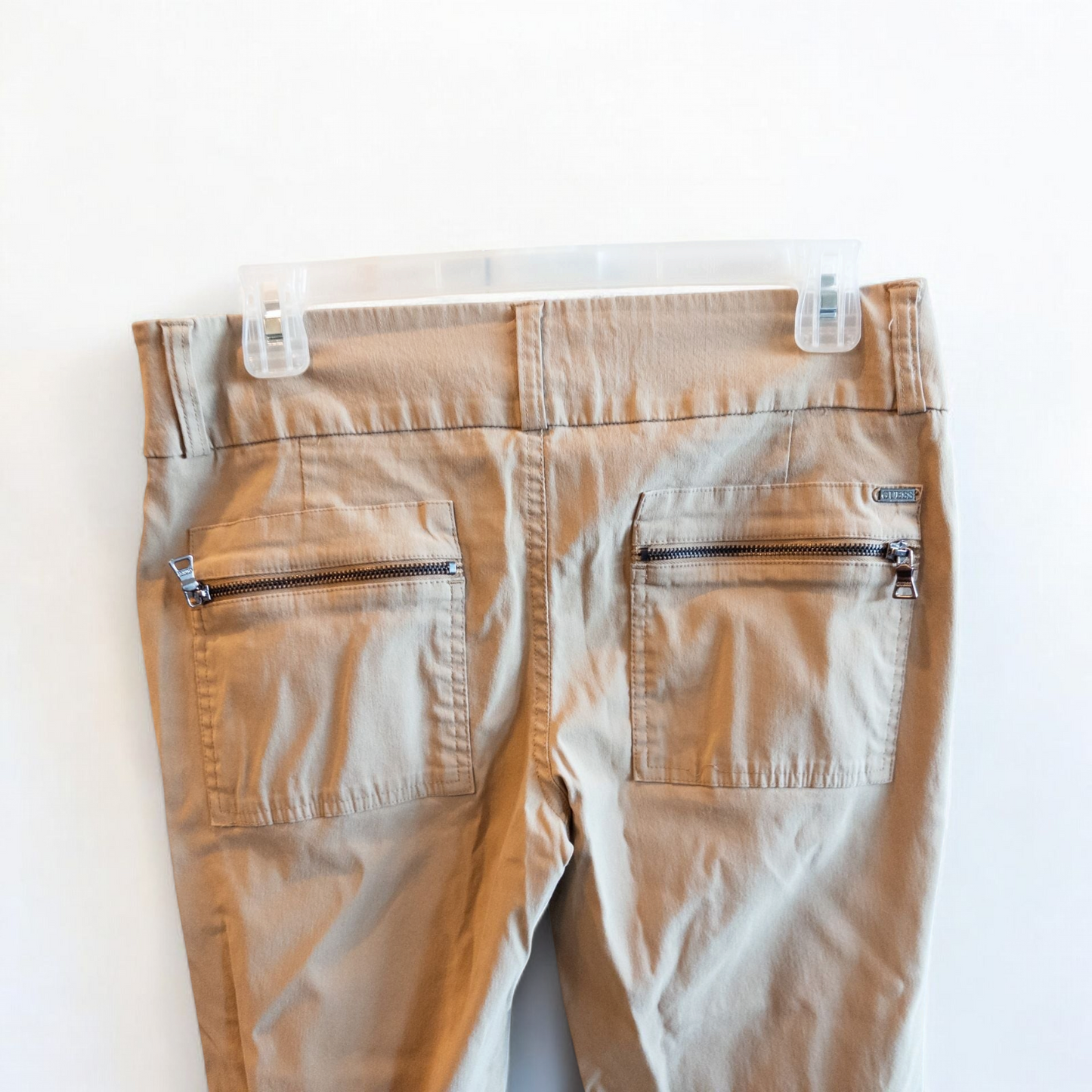 Guess vintage Y2K khaki flare pants with zippered pockets and relaxed fit hanging on a hanger image 4