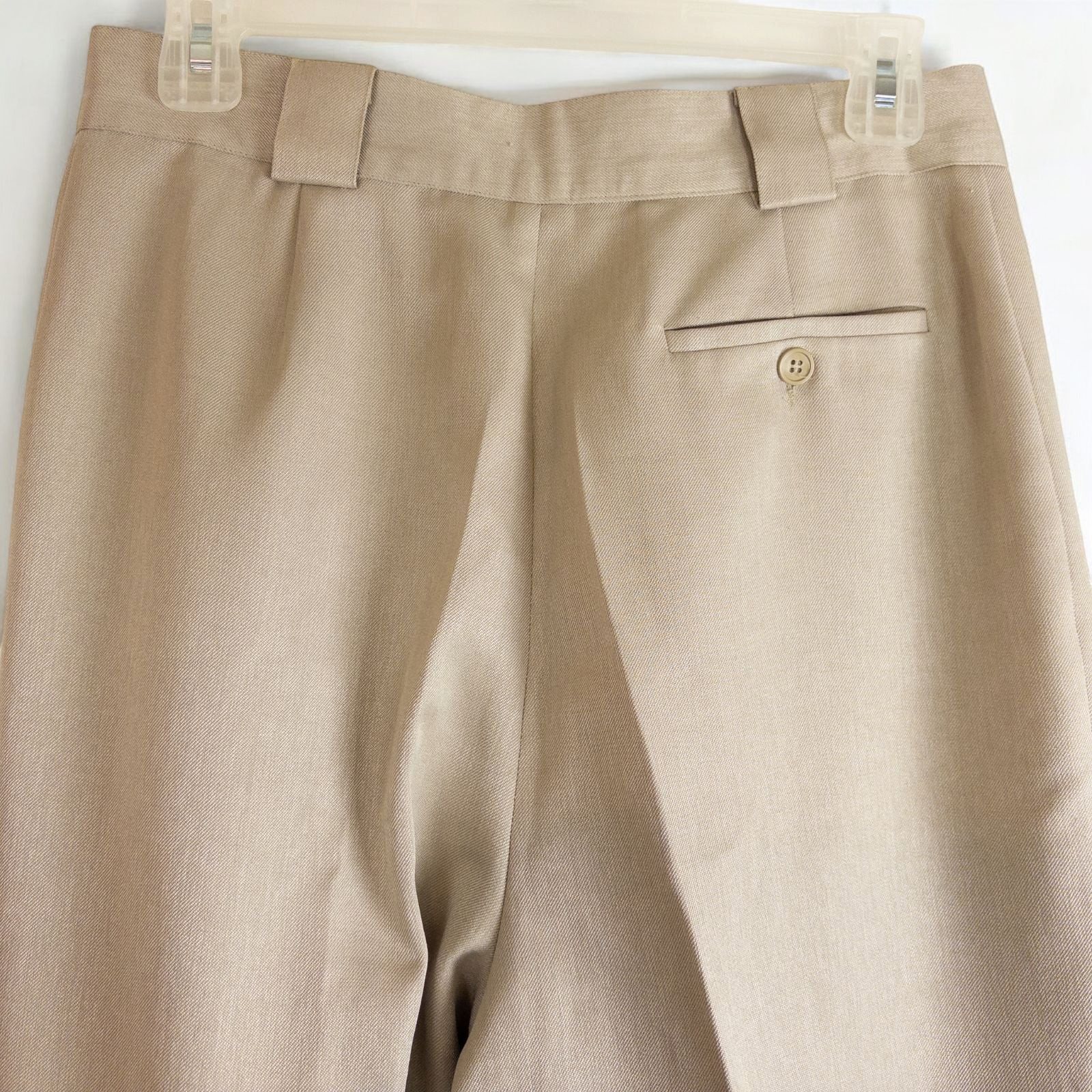 Giorgio Sant Angelo tan vintage pants with front pleats and dual button closure hanging on hanger image 9