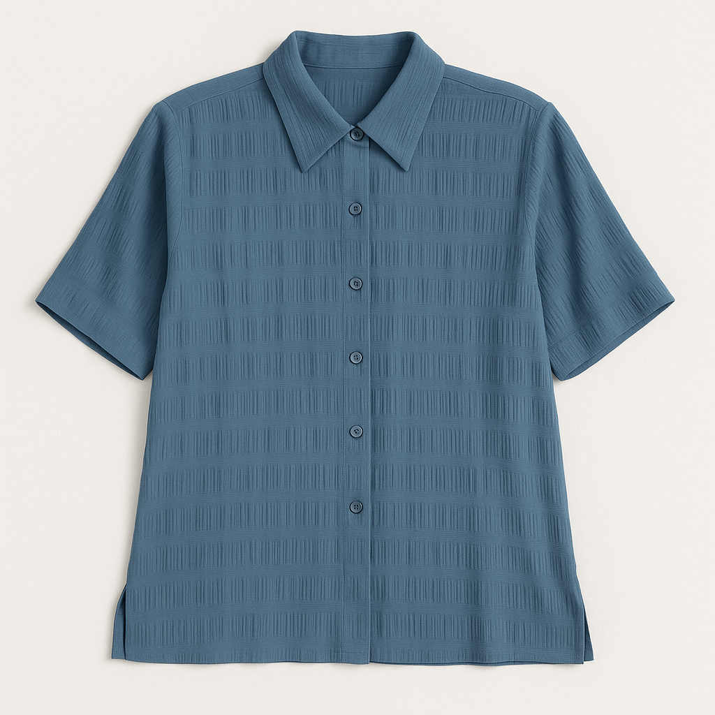 Apparenza vintage pastel blue textured button-up shirt with pointed collar and short sleeves hanging on hanger front on white dropcloth
