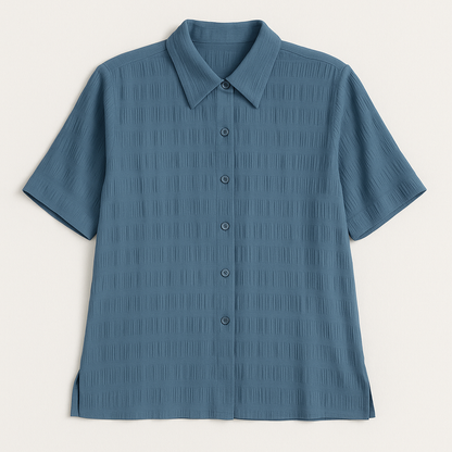 Apparenza vintage pastel blue textured button-up shirt with pointed collar and short sleeves hanging on hanger front on white dropcloth