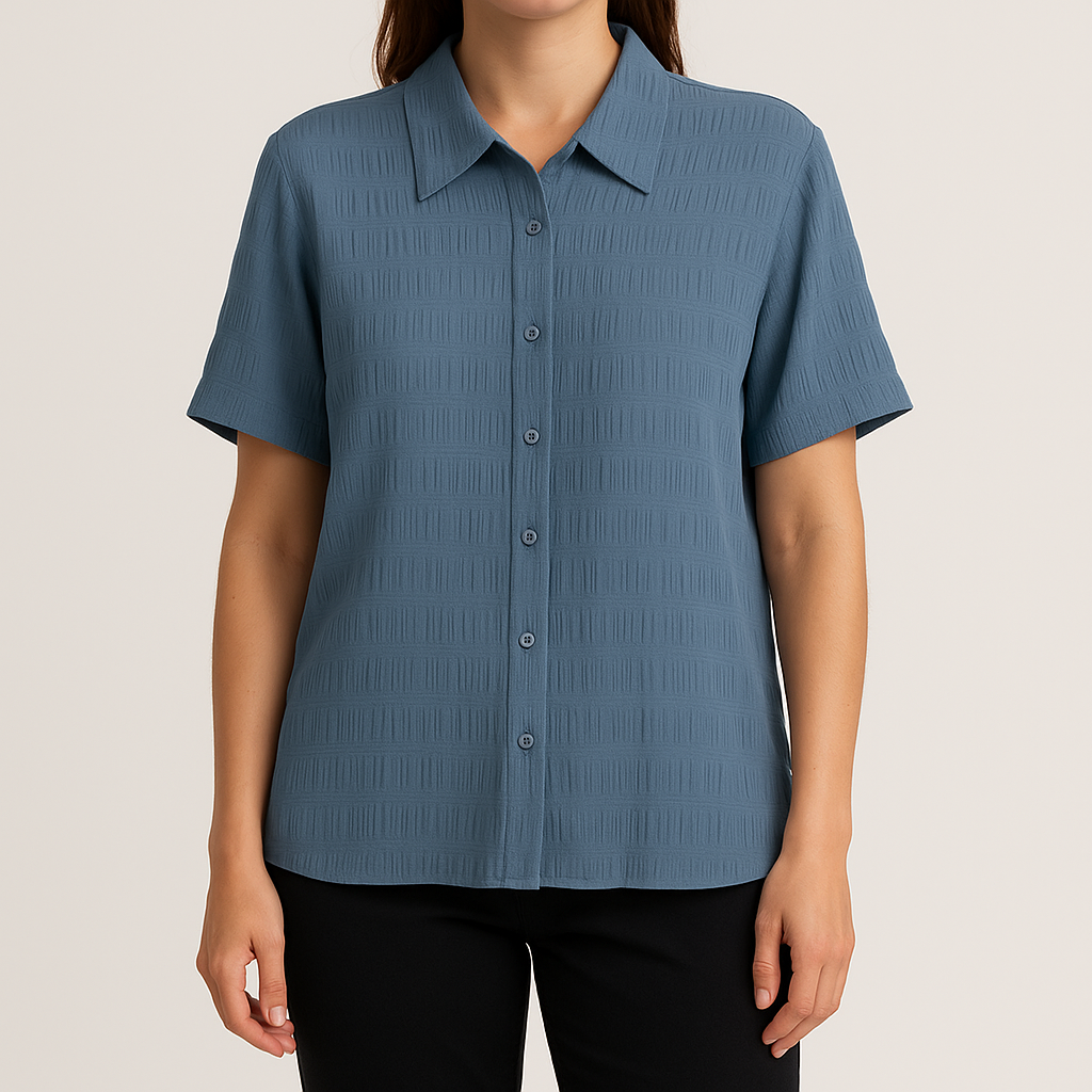 Apparenza vintage pastel blue textured button-up shirt with pointed collar and short sleeves hanging on hanger on model