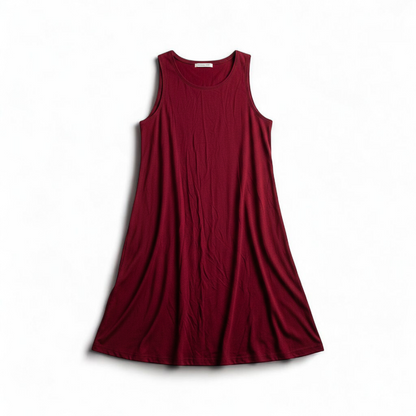 Maitai women's large red sleeveless swing dress hanging on transparent hanger front on white muslin photography backdrop