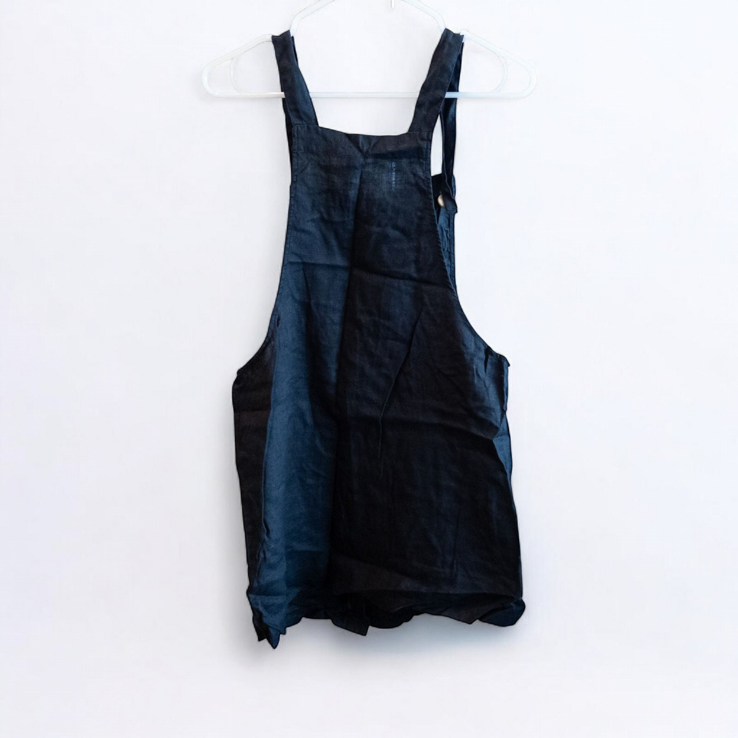 Forever 21 black linen dress with button front and adjustable straps hanging on a white hanger image 5