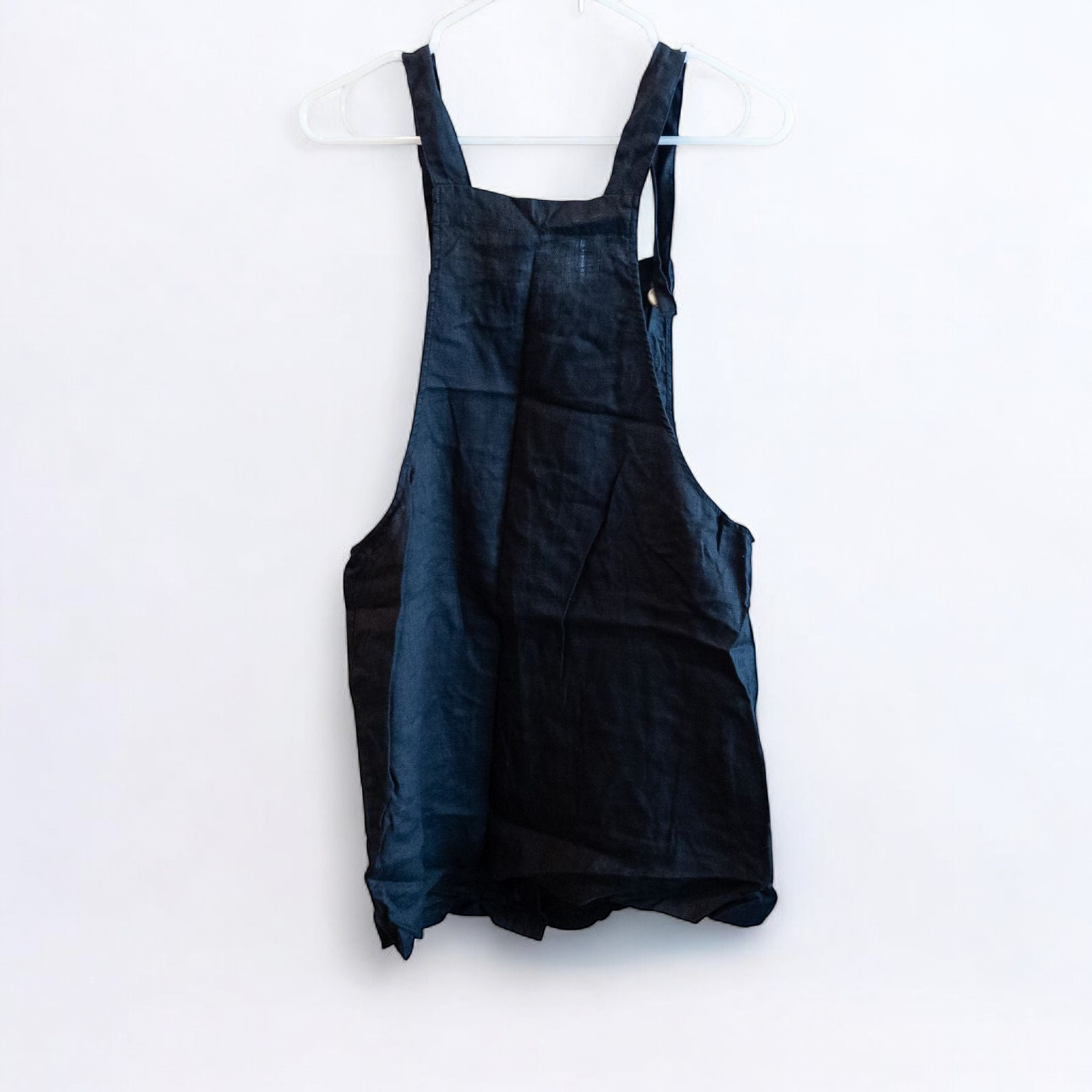 Forever 21 black linen dress with button front and adjustable straps hanging on a white hanger image 5