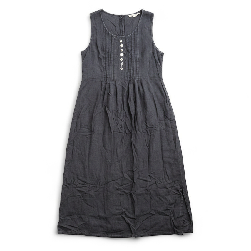 Sweet Jessie black denim long sleeveless dress with front decorative buttons and back button closure hanging on a hanger in front of a bookshelf and mirror front on white muslin photography backdrop
