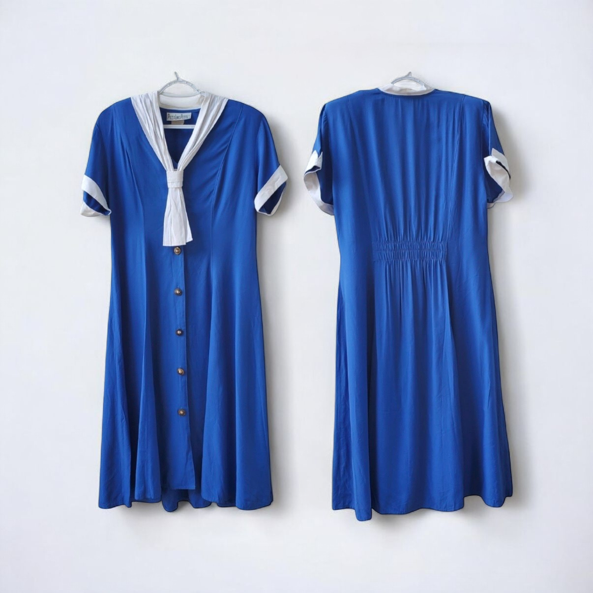 Piccalino vintage blue long sailor dress with white collar and cuff accents, button front, and short sleeves laid flat. image 2