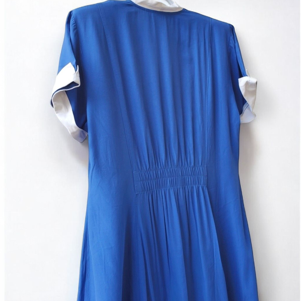 Piccalino vintage blue long sailor dress with white collar and cuff accents, button front, and short sleeves laid flat. image 6
