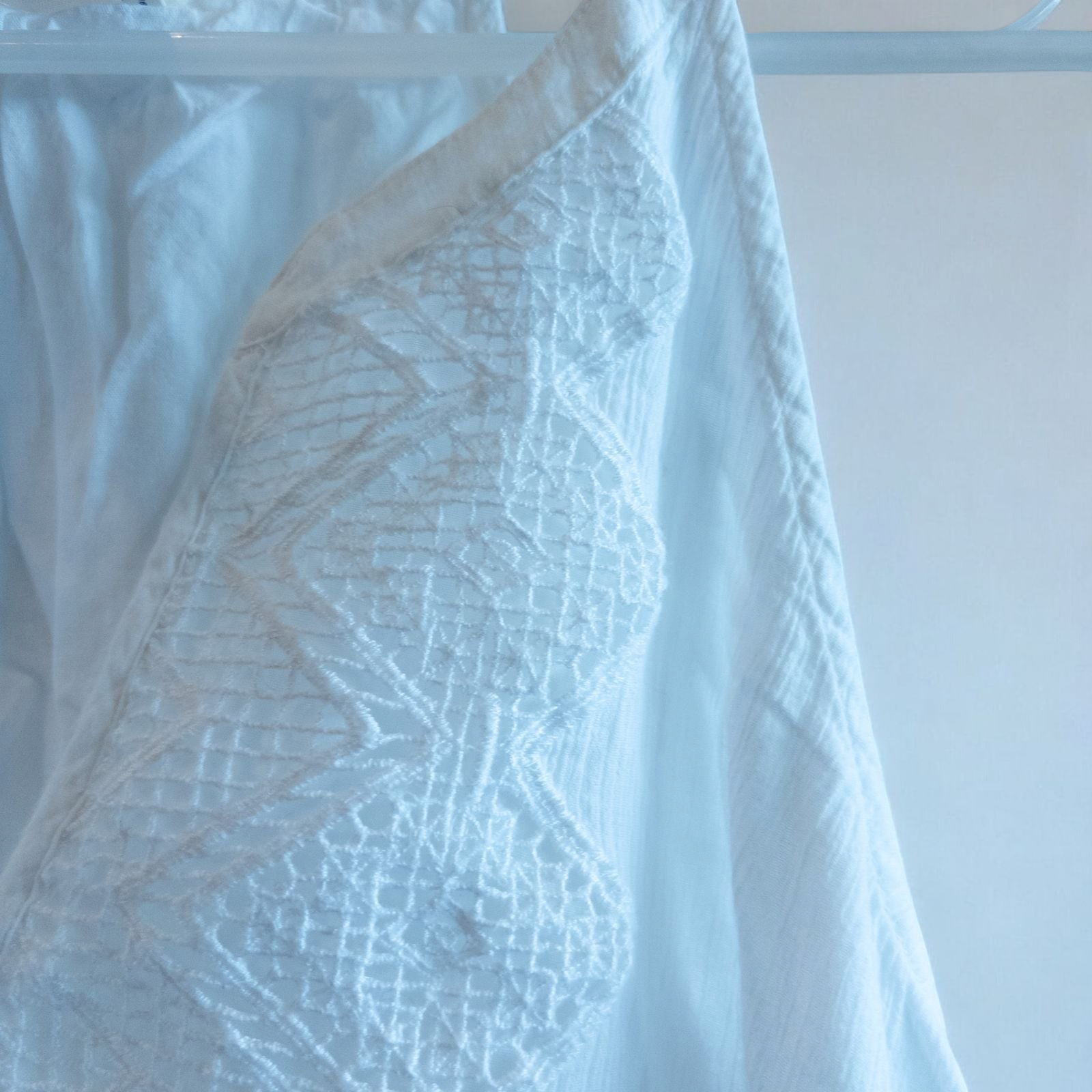 Old Navy long white sleeveless lace maxi dress hanging on hanger in room image 3