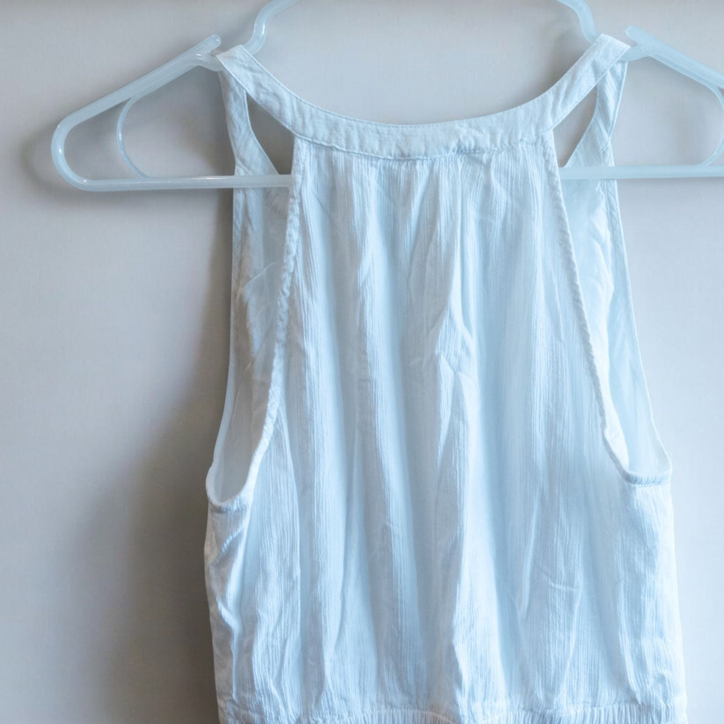Old Navy long white sleeveless lace maxi dress hanging on hanger in room image 6