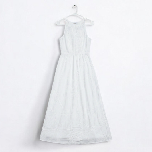 Old Navy long white sleeveless lace maxi dress hanging on hanger in room front on white muslin photography backdrop