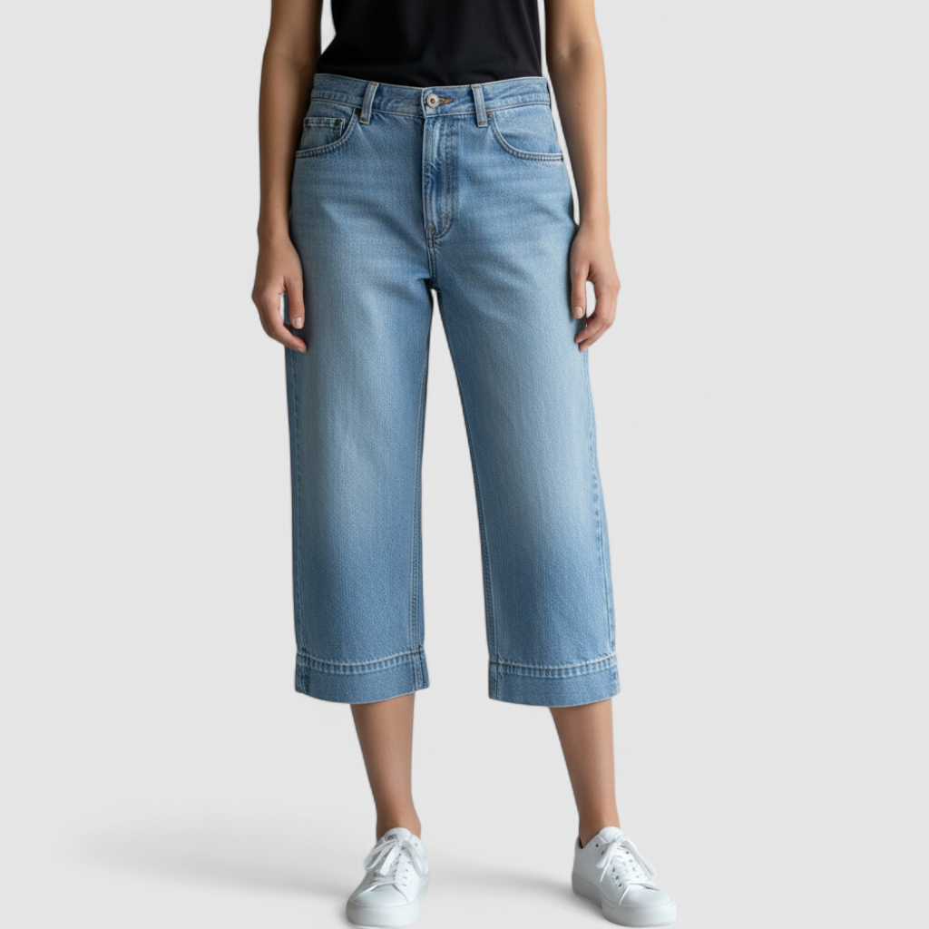 Eddie Bauer vintage blue denim capri pants with cuffed hems and five-pocket styling on model