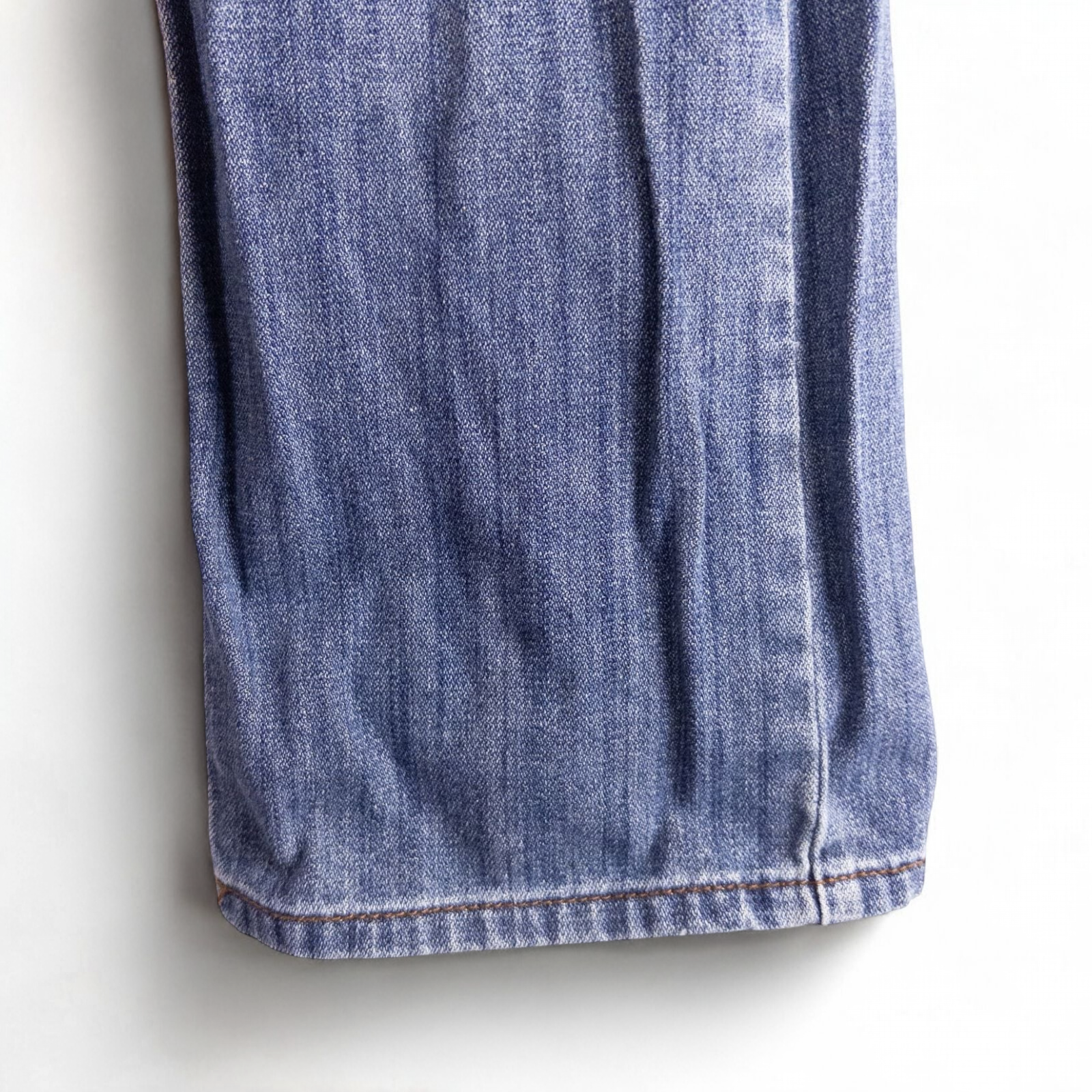 Perry Ellis women's blue denim jeans with five pockets hanging on a hanger front and back views image 7