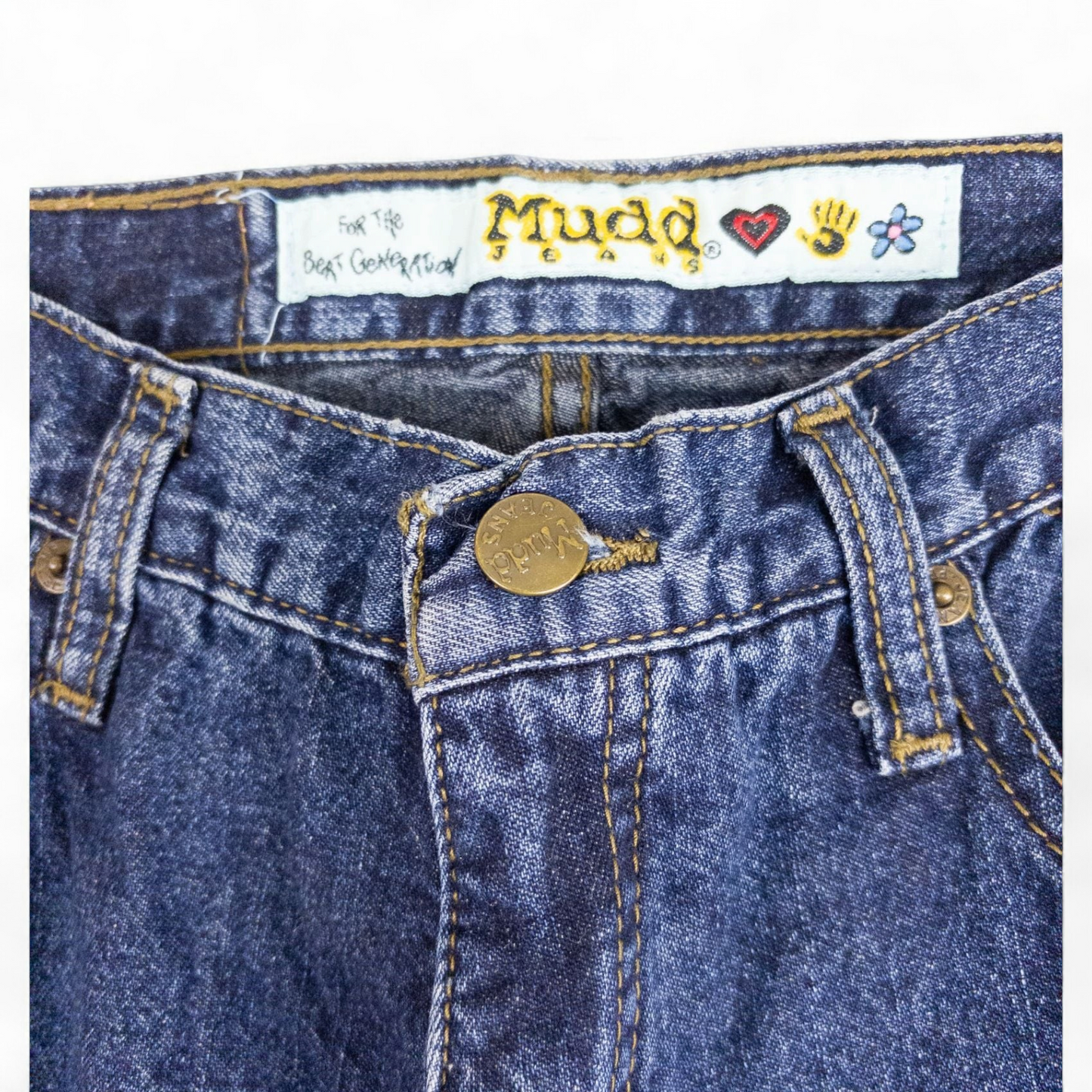 Vintage 1990s Mudd blue denim jeans with button closure hanging on hanger front view image 3