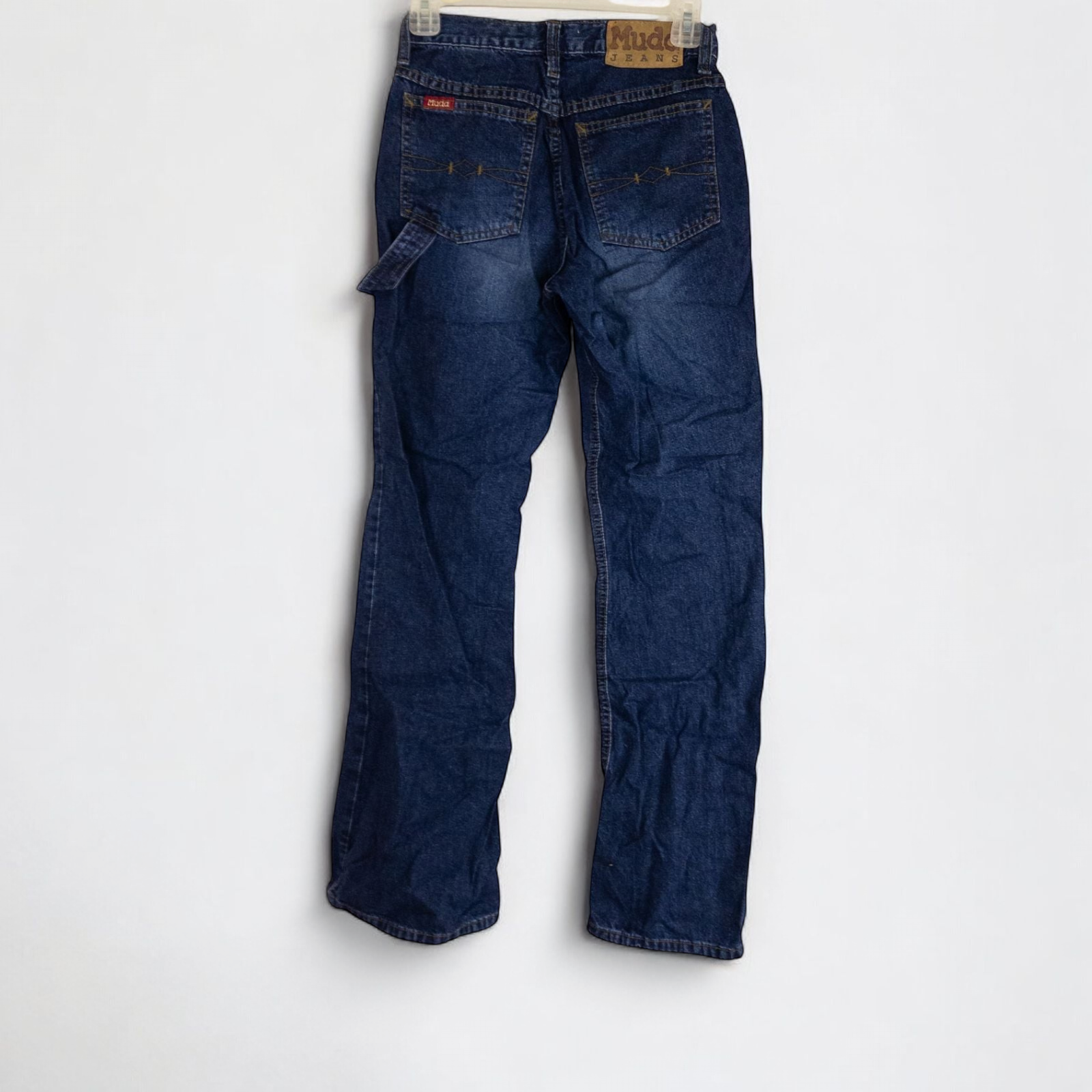 Vintage 1990s Mudd blue denim jeans with button closure hanging on hanger front view image 4