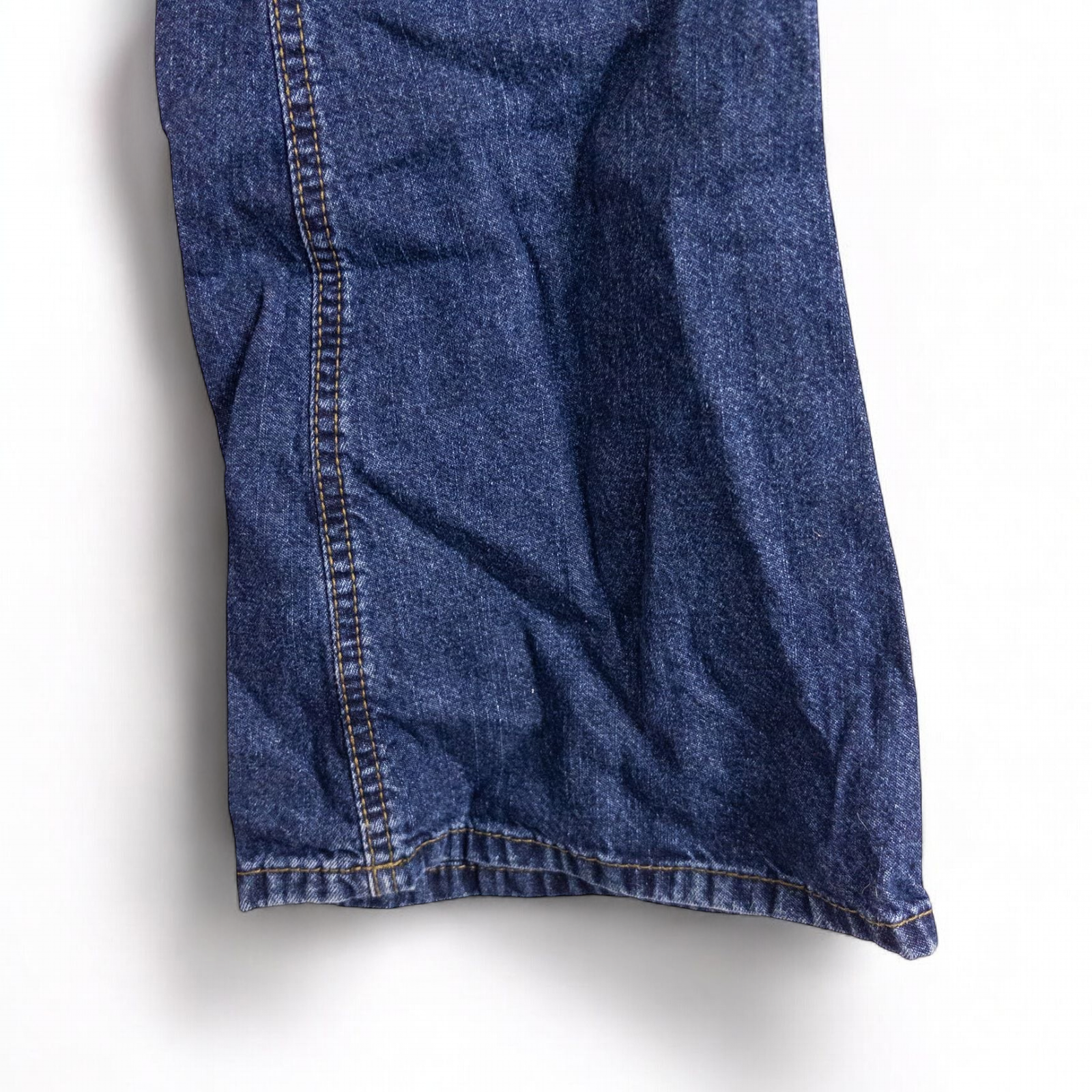 Vintage 1990s Mudd blue denim jeans with button closure hanging on hanger front view image 7