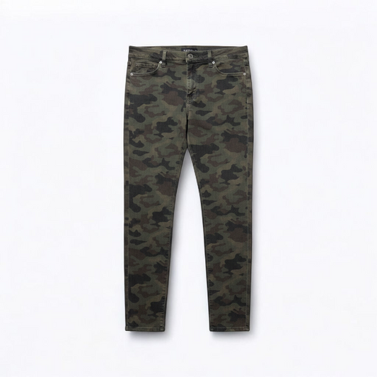 Hudson green camo skinny jeans womens size 31 with minimal wear and faux front pockets displayed hanging. front on white muslin photography backdrop