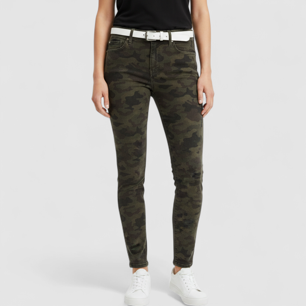 Hudson green camo skinny jeans womens size 31 with minimal wear and faux front pockets displayed hanging. on model