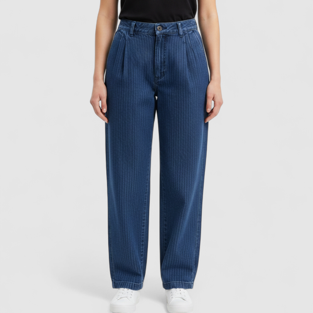 Wilkins rumble seat vintage blue striped jeans womens size 28 hanging on wood hanger in front of white background on model