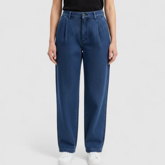 Wilkins rumble seat vintage blue striped jeans womens size 28 hanging on wood hanger in front of white background on model