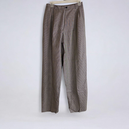 Liz Claiborne vintage black and white houndstooth pants with front zipper and button closure, pleated front, and side pockets