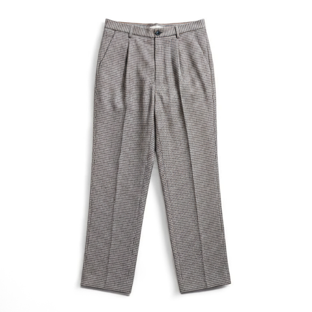 Liz Claiborne vintage black and white houndstooth pants with front zipper and button closure, pleated front, and side pockets front on white muslin photography backdrop