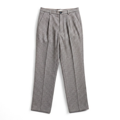 Liz Claiborne vintage black and white houndstooth pants with front zipper and button closure, pleated front, and side pockets front on white muslin photography backdrop