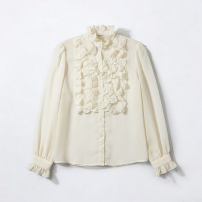 Vintage ivory ruffle blouse with long sleeves and button front front on white muslin photography backdrop