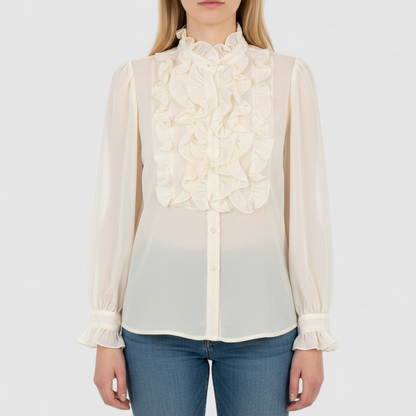 Vintage ivory ruffle blouse with long sleeves and button front on model