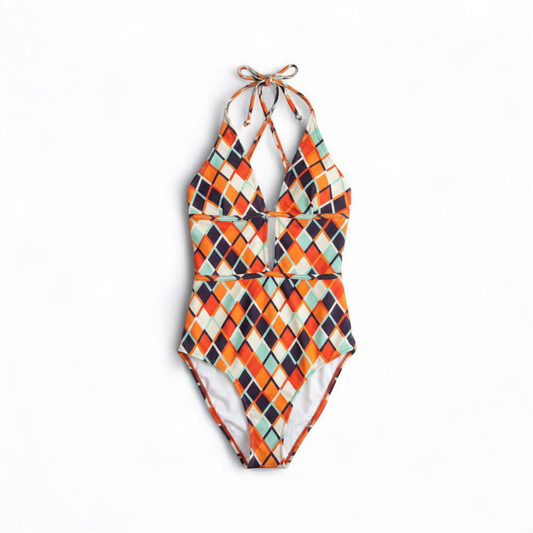 Orange teal geometric diamond pattern Cupshe one-piece swimsuit with halter neck and cutout detail shown hanging on white hanger front on white muslin photography backdrop