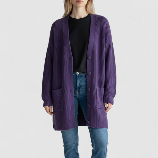 Vintage Yarnworks purple chunky knit cardigan with button front and two pockets hanging on hanger on model