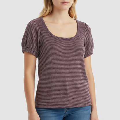 Free People knit purple and gold short puff sleeve sweater top on hanger against white background on model