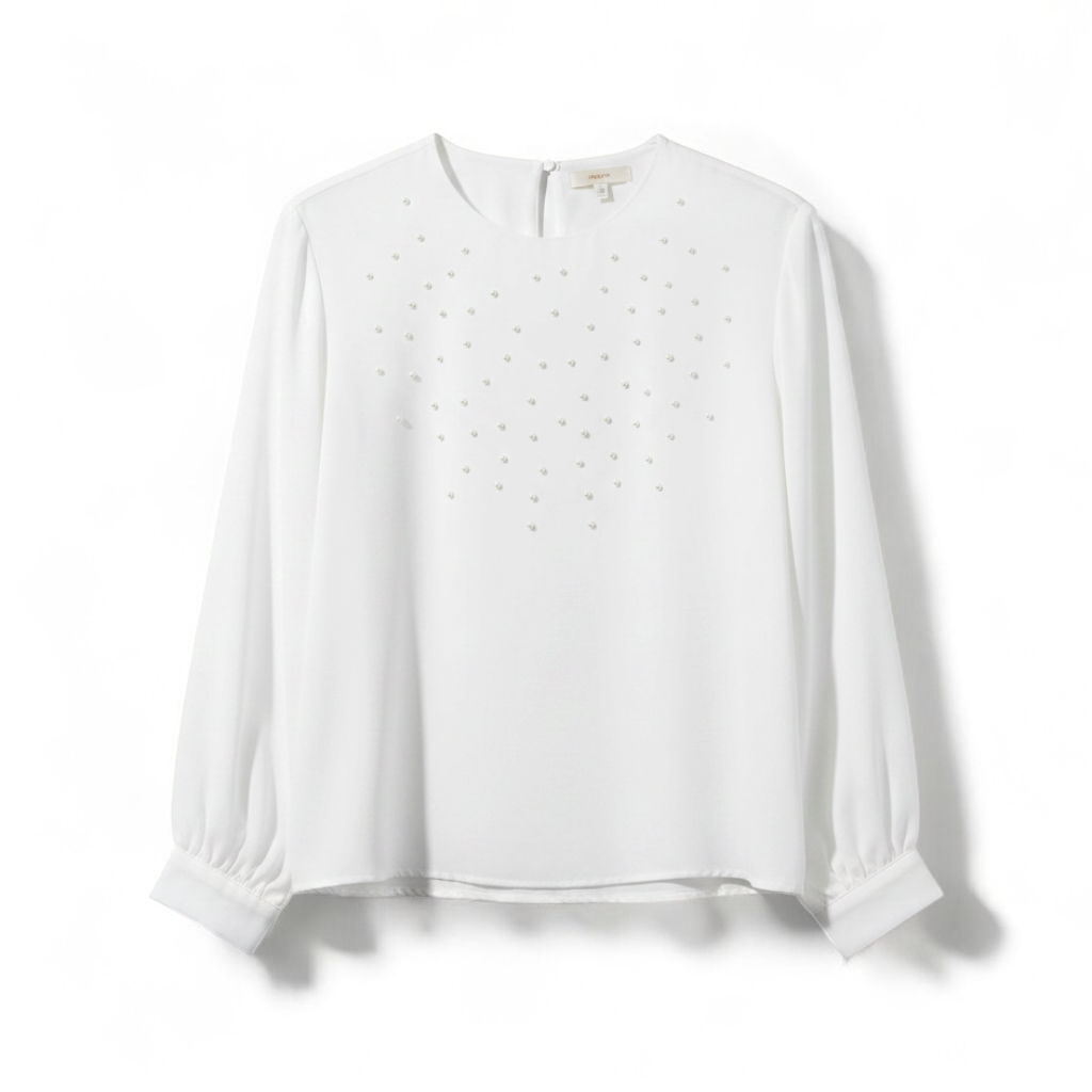 Anne Kriste vintage white sheer blouse with pearl beading on front and long sleeves with button cuffs hanging on hanger front on white muslin photography backdrop
