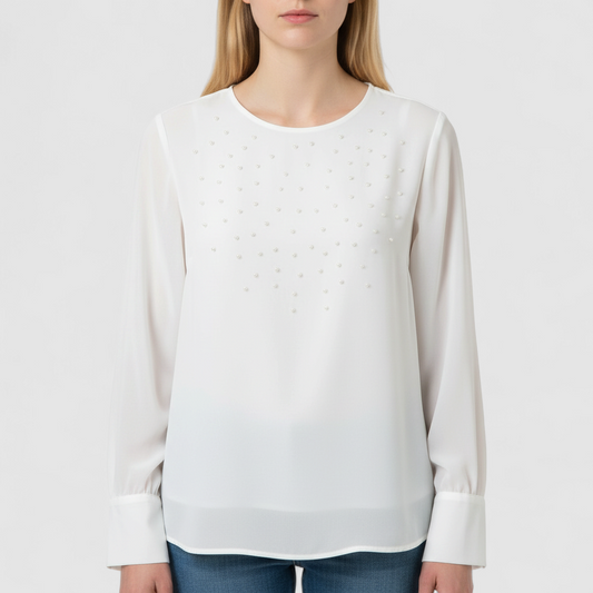 Anne Kriste vintage white sheer blouse with pearl beading on front and long sleeves with button cuffs hanging on hanger on model
