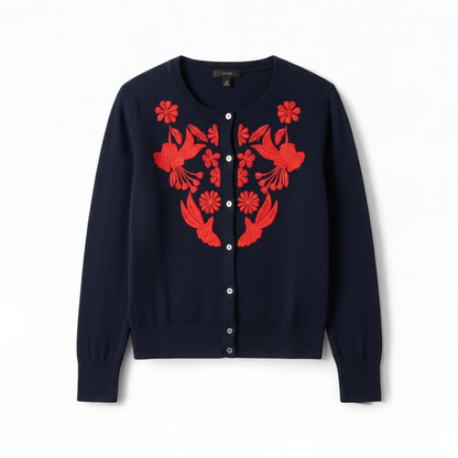 J Crew navy blue cardigan sweater with red embroidered floral design on front, button closure, long sleeves, and crew neck. front on white muslin photography backdrop
