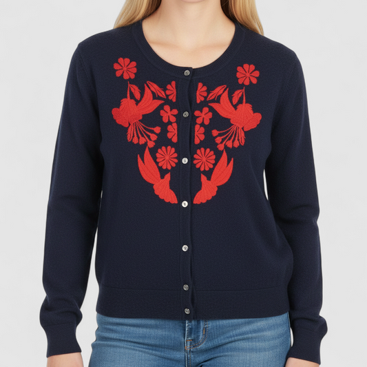 J Crew navy blue cardigan sweater with red embroidered floral design on front, button closure, long sleeves, and crew neck. on model