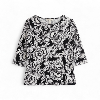 JM Collection black and white floral blouse top with 3/4 sleeves and crew neck, women's medium petite size front on white muslin photography backdrop