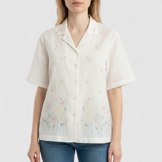 Alfred Dunner vintage white beaded floral shirt with short sleeves and button front closure on model