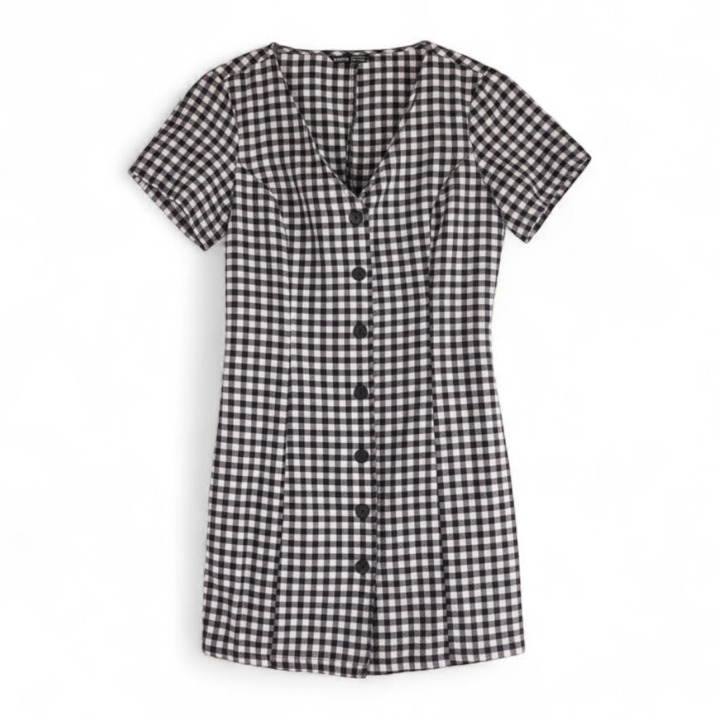 Shein black and white checkered tunic mini dress with button front and short sleeves front on white muslin photography backdrop