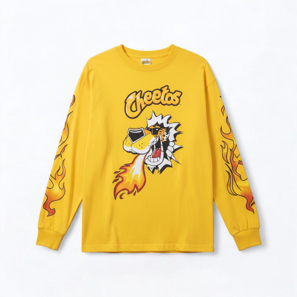Yellow long sleeve shirt with Cheetos flame-breathing mascot graphic on front and flaming hot text on back front on white muslin photography backdrop