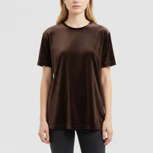 Williwear vintage brown velvet top with short sleeves and crew neckline hanging on a hanger on model