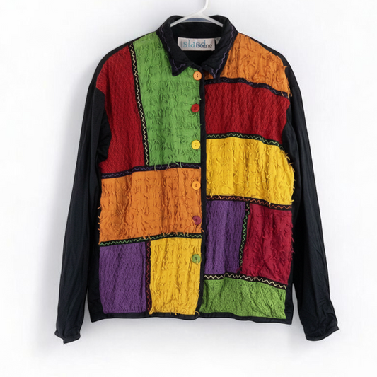 Island Scene vintage 1990s women's large rainbow patchwork jacket with textured knit panels and multicolor buttons front on white muslin photography backdrop