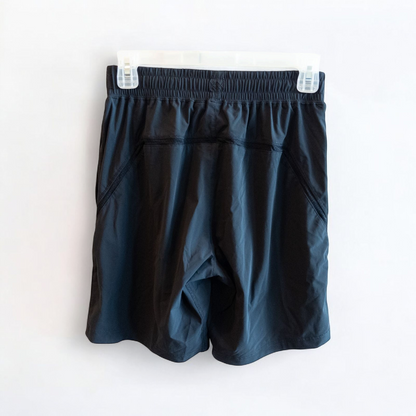 Rhone black athletic shorts for men with elastic waistband and zippered pockets hanging on hanger image 4