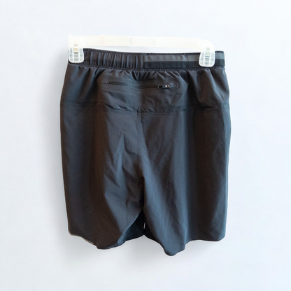 Black lululemon men's lightweight athletic shorts with elastic waistband and drawstring tie hanging on clips image 4