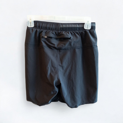 Black lululemon men's lightweight athletic shorts with elastic waistband and drawstring tie hanging on clips image 5