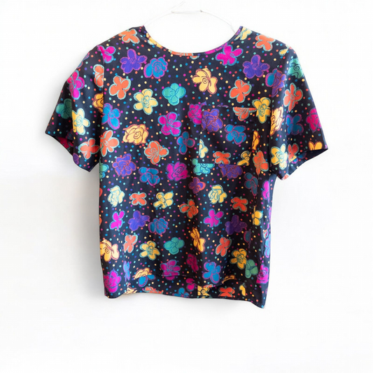 Worthington vintage black blouse with colorful purple floral and polka dot print, short sleeves, and padded shoulders.
